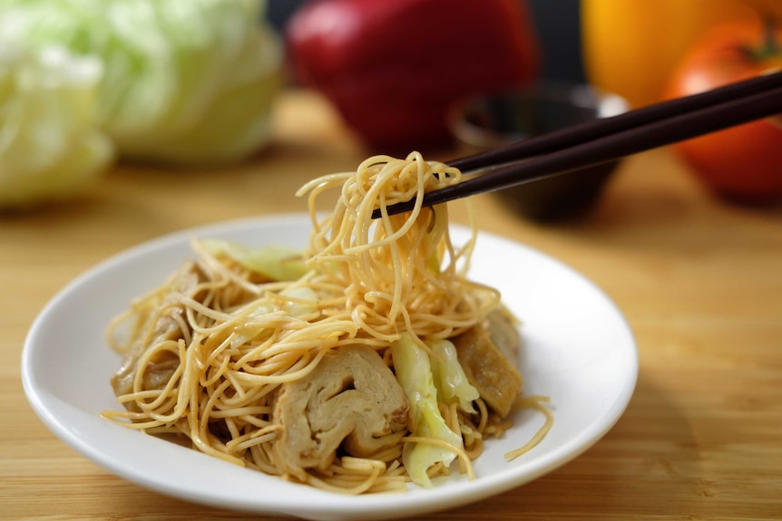 A picture of a bowl of noodles about to be eaten, perfect for ringing in the Chinese new year.