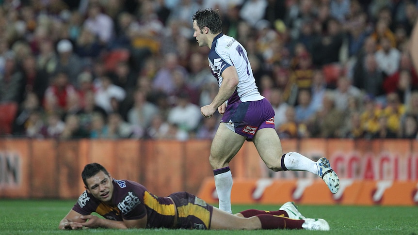 Match winner ... Cooper Cronk punches his fist after landing his field goal against the Broncos