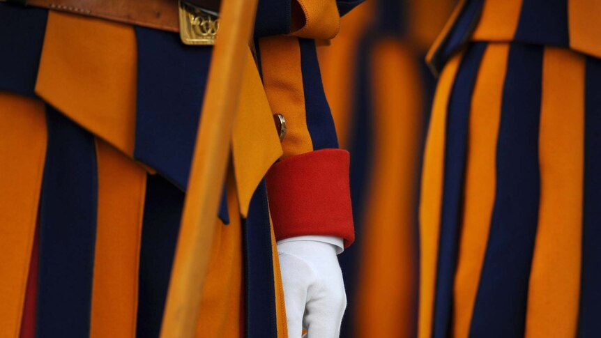 Swiss guards stand in front of St Peter's Basilica