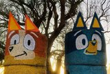 Hay bales decorated to look like children's cartoon characters Bingo and Bluey