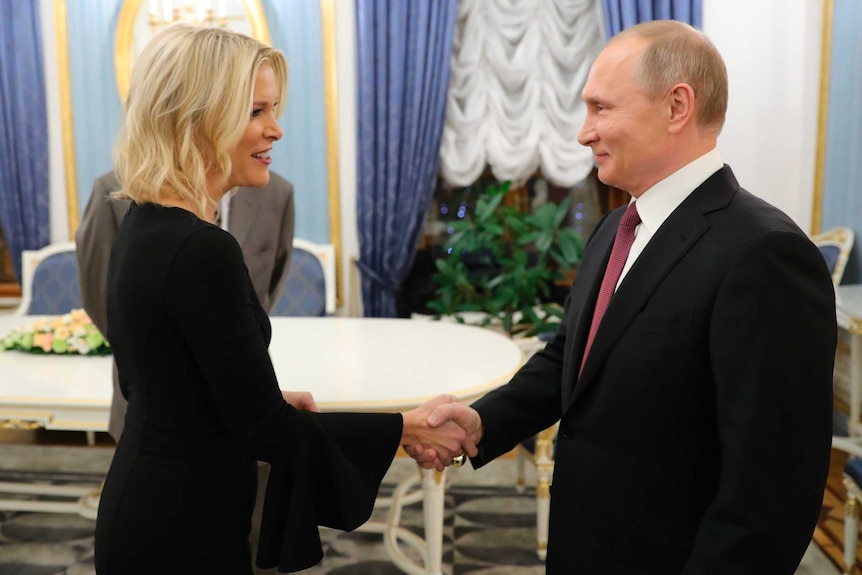 American broadcaster Megyn Kelly shakes hands with Russian President Vladimir Putin inside the Kremlin in Moscow.