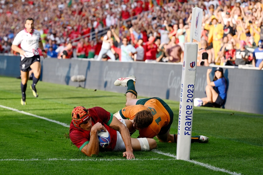 Nicolas Martins is tackled into touch