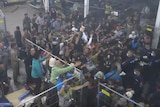 Hungarian authorities are seen on camera throwing food at a crowd of asylum seekers