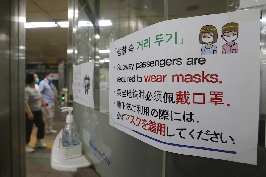 A notice on precautions against the coronavirus is displayed at a subway station in South Korea.