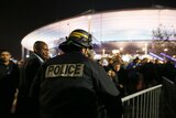 Police control crowds leaving the Stade de France