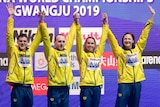 Australia's mixed 4x100m medley relay team, from left, Mitchell Larkin, Matthew Wilson, Emma Mckeon and Cate Campbell celebrate on the podium after winning the final at the World Swimming Championships in Gwangju, South Korea