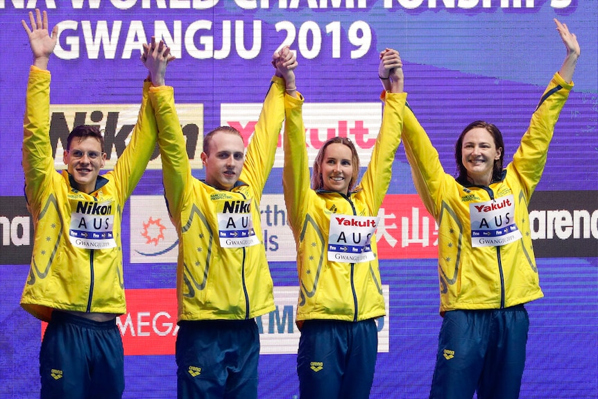 Australia's mixed 4x100m medley relay team, from left, Mitchell Larkin, Matthew Wilson, Emma Mckeon and Cate Campbell celebrate on the podium after winning the final at the World Swimming Championships in Gwangju, South Korea