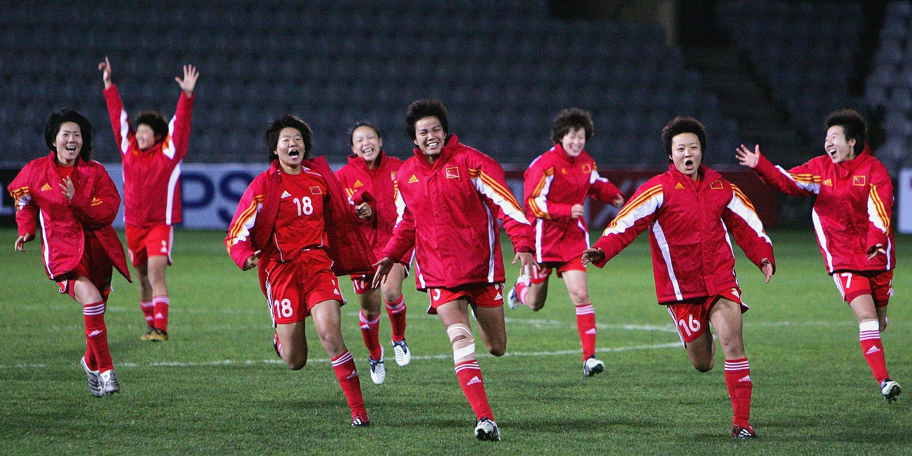 Chinese players run together after winning the 2006 Women's Asian Cup final against the Matildas.