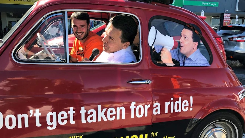 Nick Xenophon is a small car with campaign slogans on the doors.