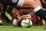 Samu Kerevi scores a try against the Sharks