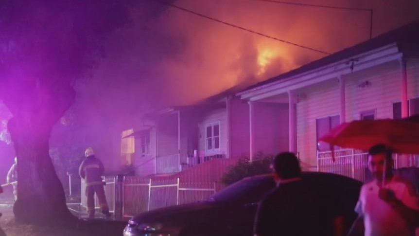 Flames rise out of a home at Granville.