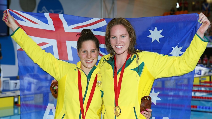 Emily Seebohm and Belinda Hocking show off their medals
