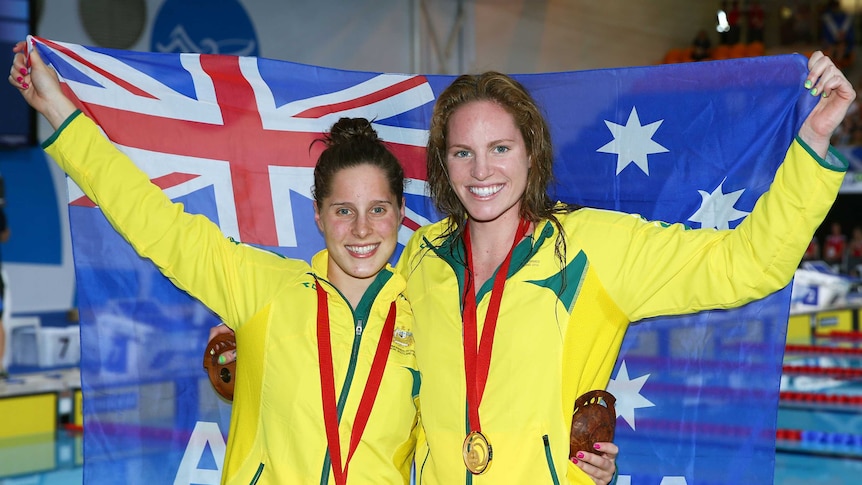 Australia's Emily Seebohm (R) and Belinda Hocking took gold and silver in the 100m backstroke.