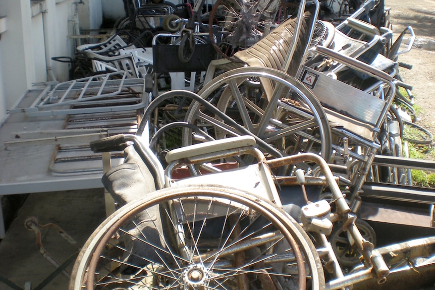 A pile of broken wheelchairs.