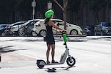 Woman on an e-scooter in Melbourne
