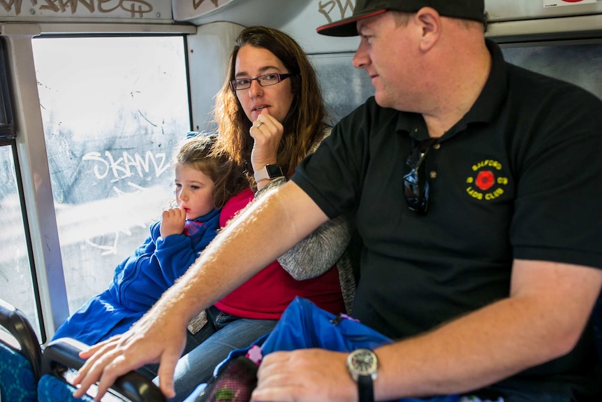 The McMurtries on the bus taking Chloe McMurtrie to school.