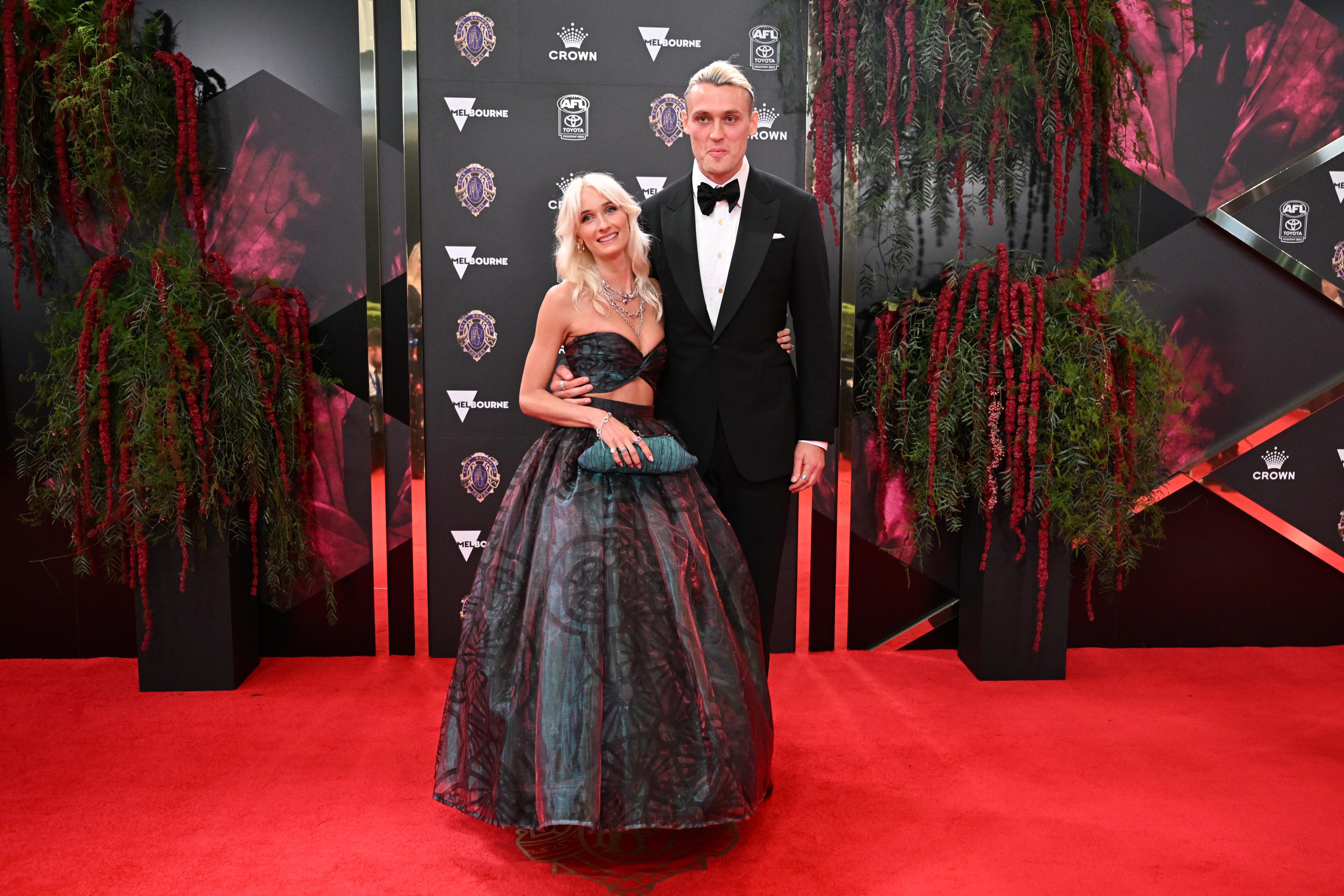 Collingwood's Darcy Moore with his date who is very much on the iridescent theme of the night.