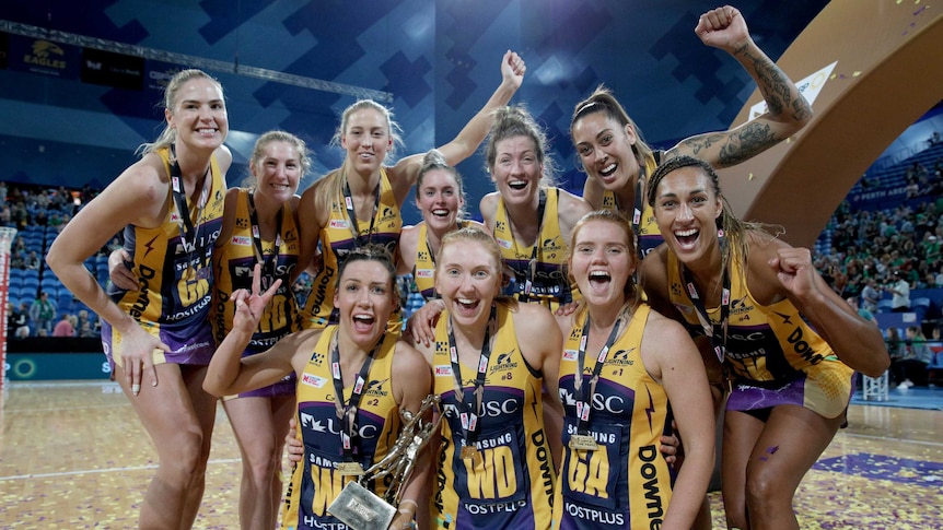 Sunshine Coast Lightning players celebrate winning the Super Netball Grand Final at Perth Arena.
