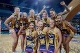Sunshine Coast Lightning players celebrate winning the Super Netball Grand Final at Perth Arena.