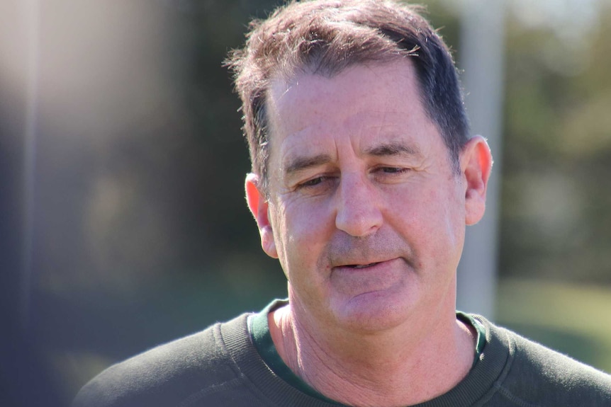 A headshot of Ross Lyon speaking at a park.