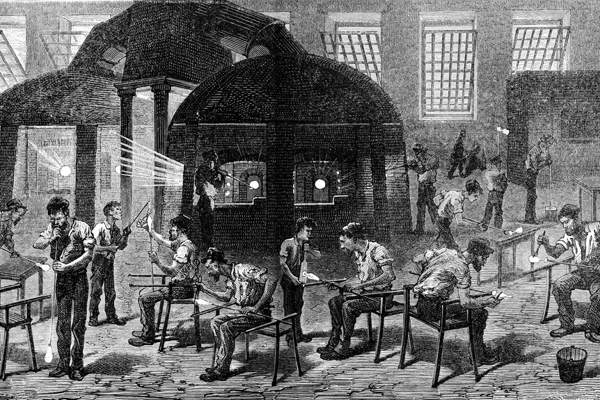 An old engraved illustration of glass manufacture, showing a factory room floor with various men working to create glass bulbs