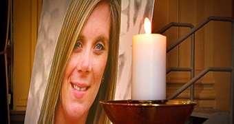 Tara Costigan's photo with a candle at her funeral.