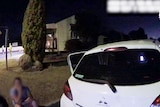 A still from a police bodycam video of a car