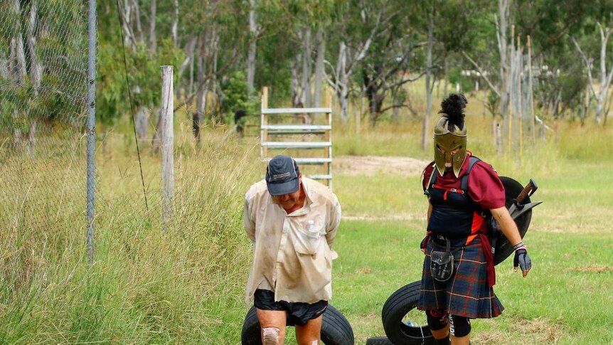 Dave Holleran and a friend dressed up as a spartan completing the world's longest obstacle course, near Eidsvold, in 2018.