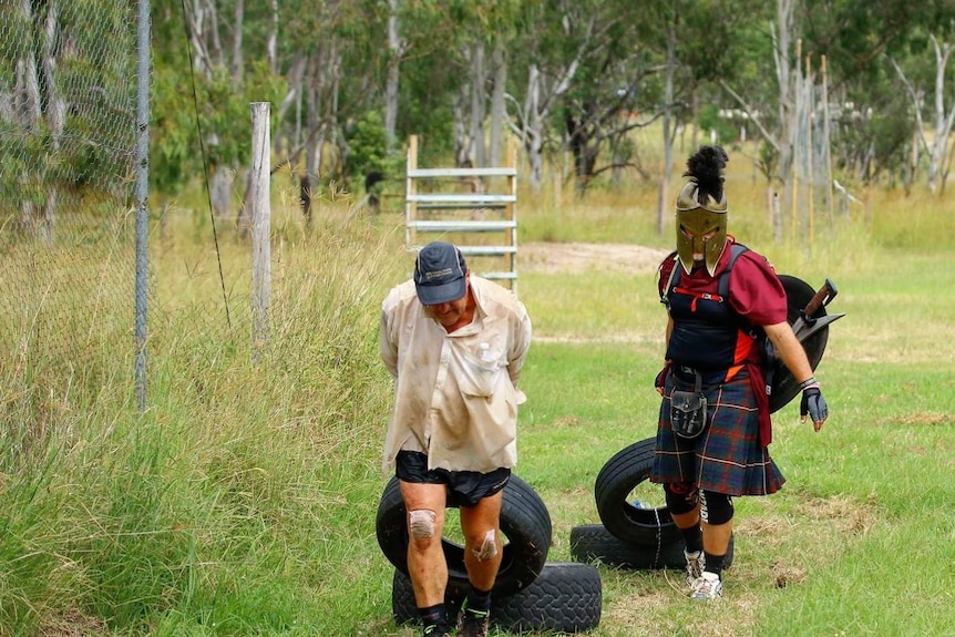 Dave Holleran and a friend dressed up as a spartan completing the world's longest obstacle course, near Eidsvold, in 2018.