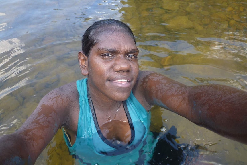 Selfie taken by a young aboriginal girl in the water