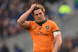 Michael Hooper holds his hair and looks down