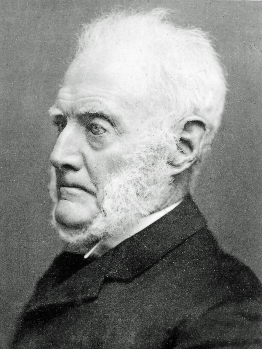 A black and white portrait of a man in the 1870s