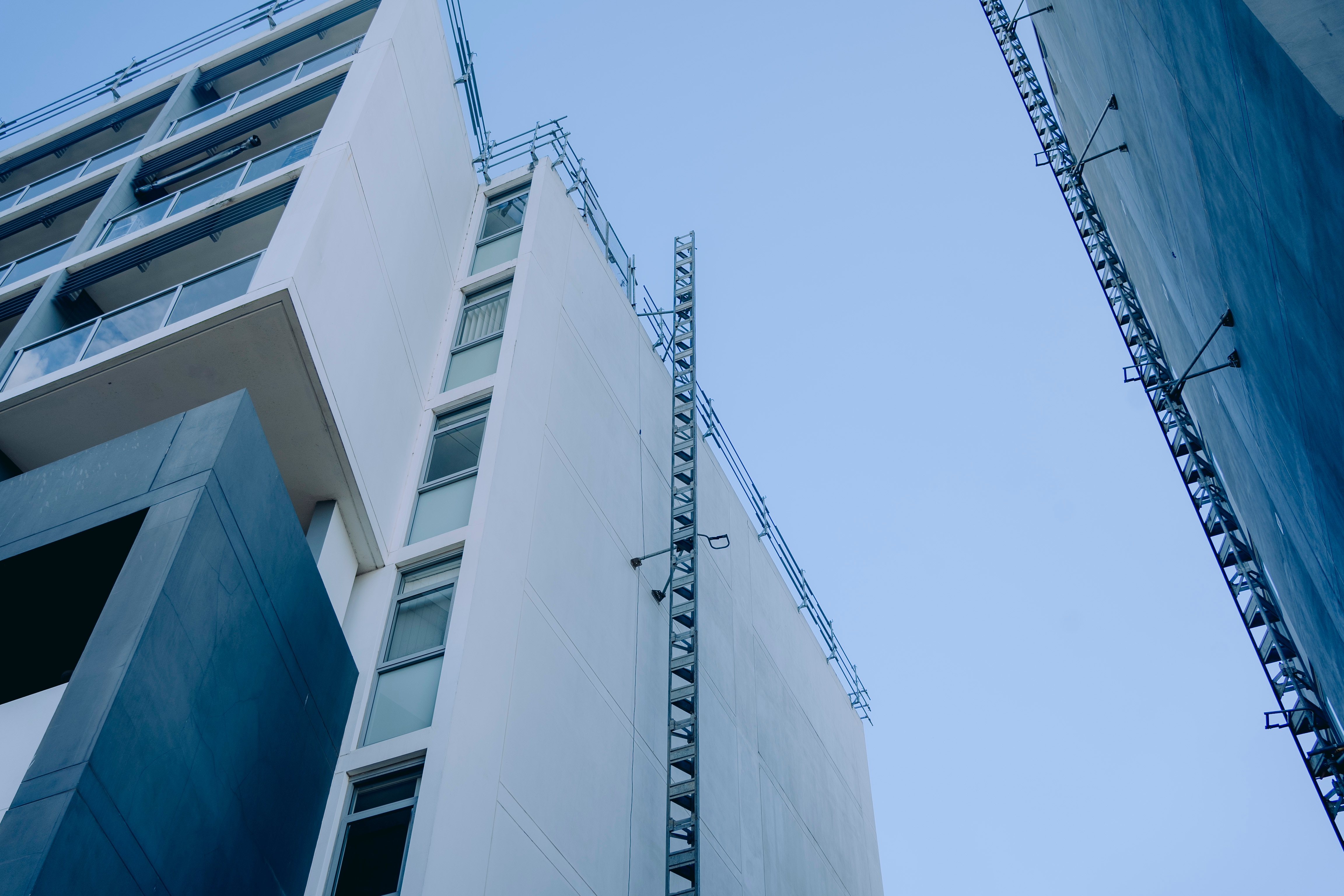 A view from the ground of a high apartment block.