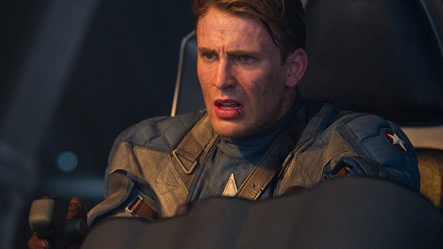 Steve Rogers in his Captain America outfit flying a plane.