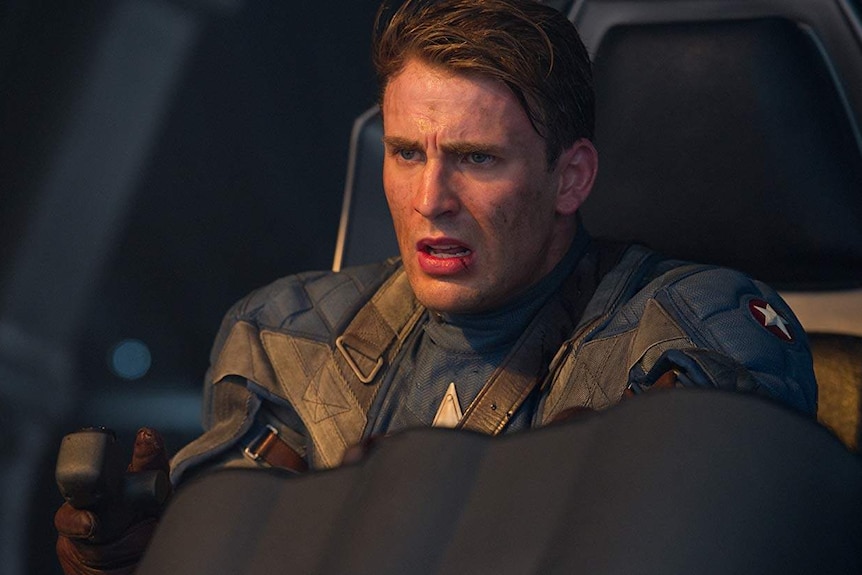 Steve Rogers in his Captain America outfit flying a plane.