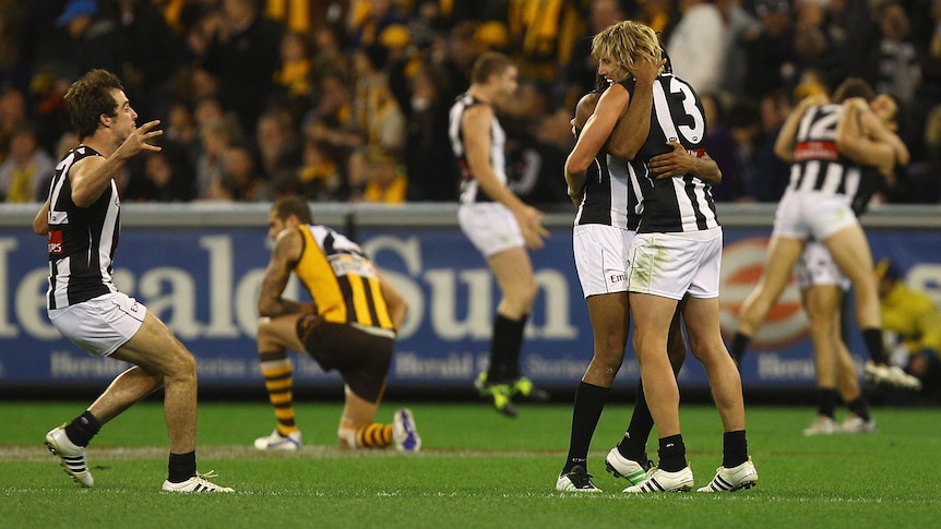 Steele Sidebottom, Harry O'Brien and Dale Thomas celebrate after Collingwood's thrilling win over Hawthorn.