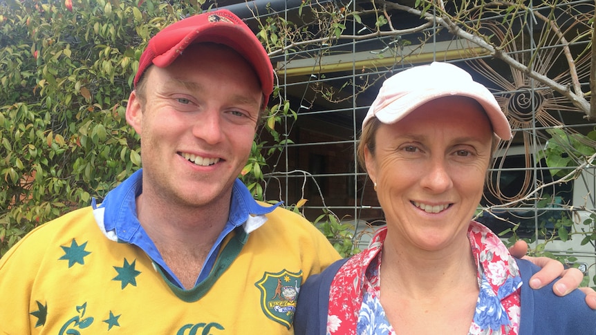 Young farmer Bill Browning and his mother Jodie stand in front of the family work ute, at the farmhouse near Narromine.