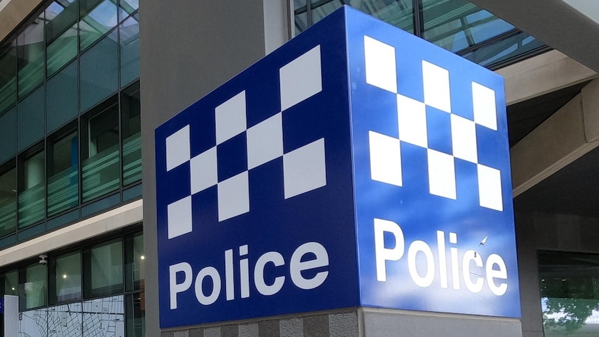 A blue and white Victoria Police sign outside HQ in Melbourne.