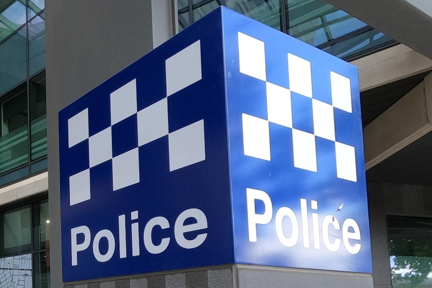 A blue and white Victoria Police sign outside HQ in Melbourne.