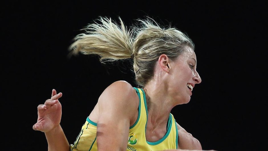 Maria Tutaia of the Silver Ferns competes with Laura Geitz.