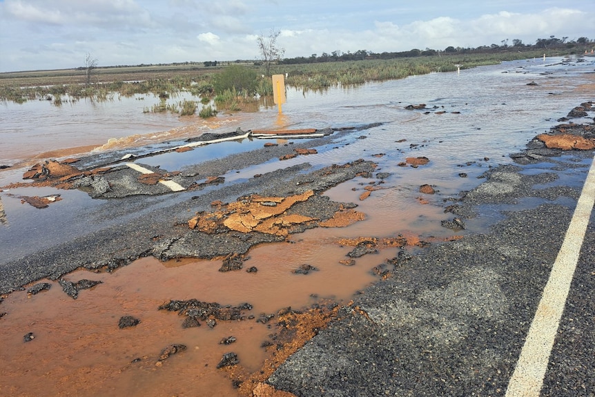 A damaged, waterlogged road 