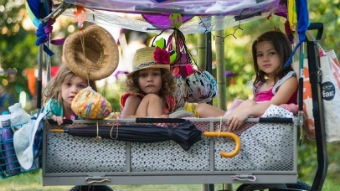 Children sit in a cart at the Woodford Folk Festival.