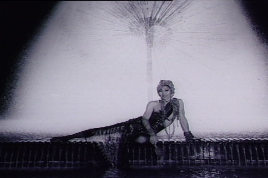 Ayesha poses in front of a fountain at Kings Cross in the 1960s.