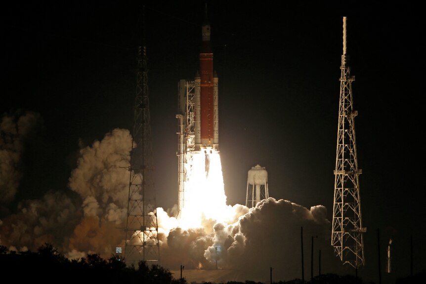 A rocket launching at night.