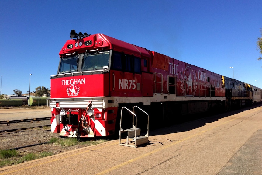 The red Ghan train stopped on its tracks at Alice Springs.