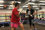 Shara Romer in the ring training at her gym.