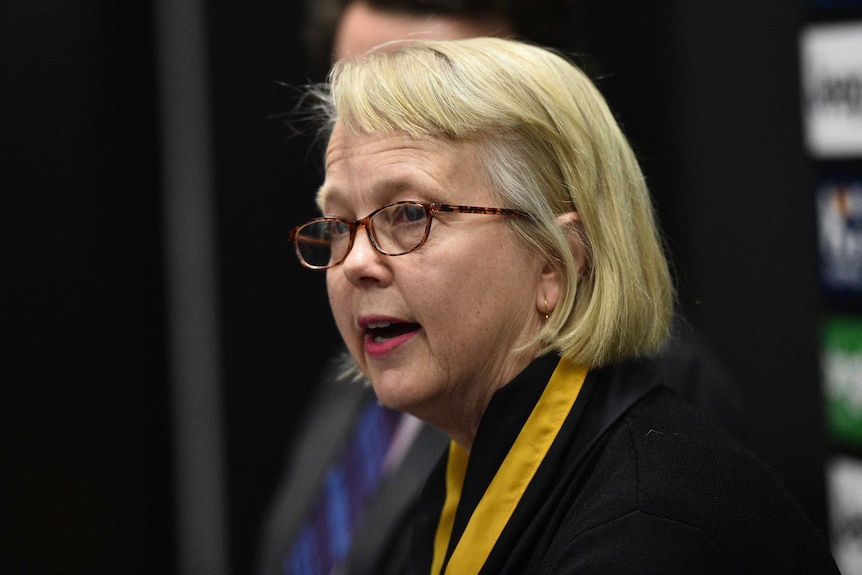 Peggy O'Neal speaks at a press conference