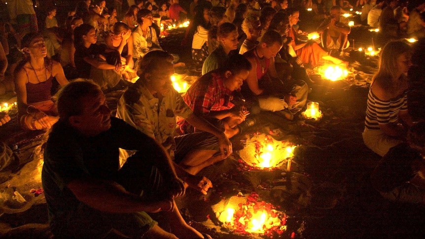 People pray two days after Bali bombing.