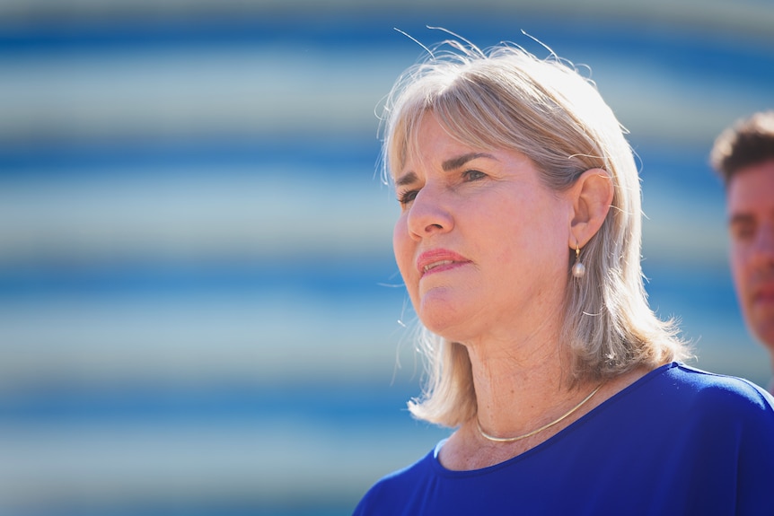 NT Infrastructure Minister Eva Lawler speaking at a press conference, outside on a sunny day. 