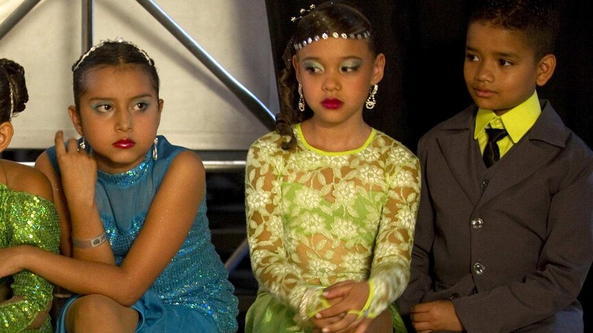 Child tango dancers wait to perform.